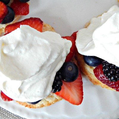 Bursting Berry Shortcakes Strawberries Blackberries Blueberries Whipped Cream Shortcakes on Sugar Bananas