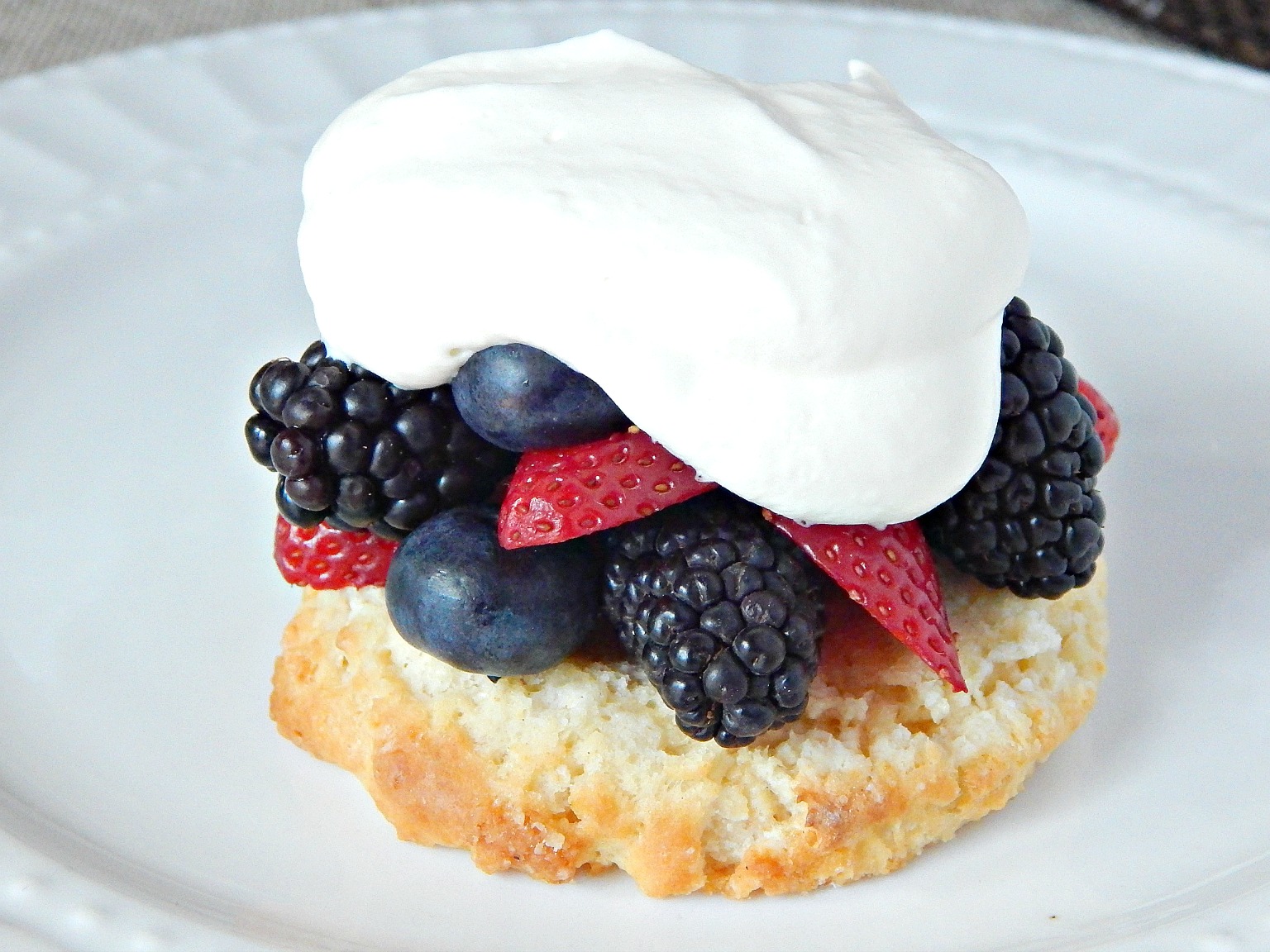 cream strawberries blueberries blackberries for Berry Shortcakes on SugarBananas