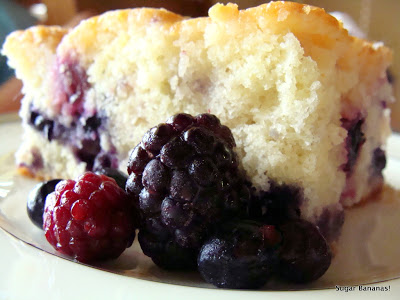 closeup of lemon staked berry cake with fresh blackberries raspberries and blueberries on www.sugarbananas.com