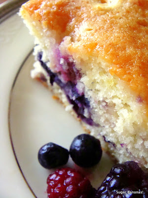 lemon soaked berry cake with fresh blueberries and raspberries on a platinum ringed plate on www.sugarbananas.com