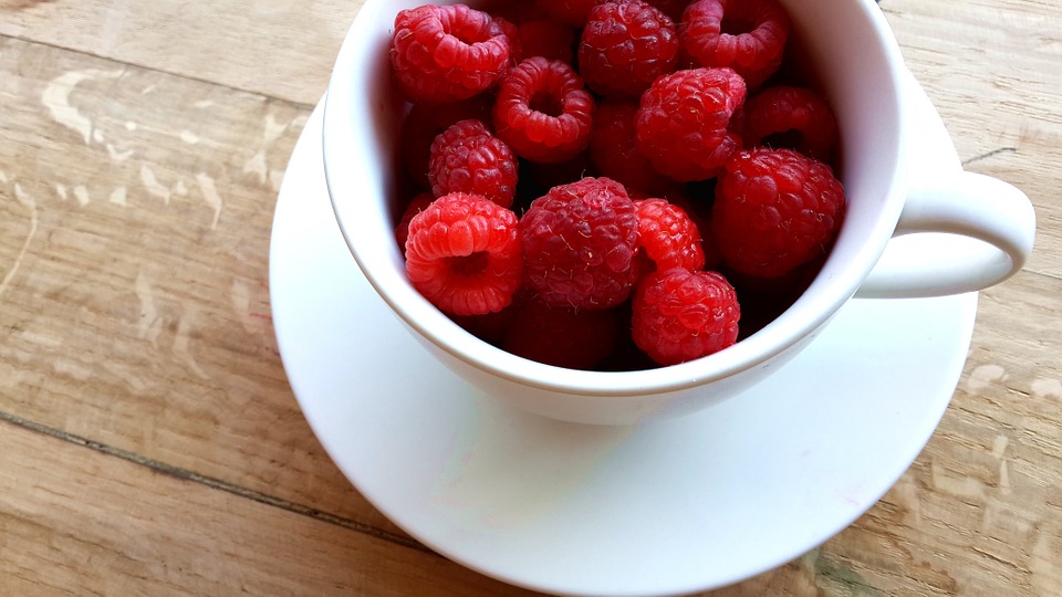 raspberries in a mug