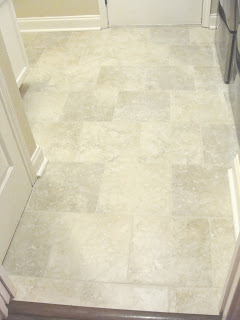 beautiful after picture of grout colored and sealed easily in laundry room with washer and dryer on www.sugarbananas.com