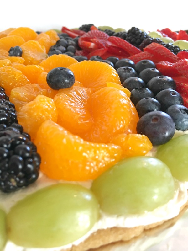 Easter Egg Fruit Pizza Cookie close up of blueberries and mandarin oranges and grapes