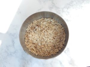 bowl-of-uncooked-oatmeal-for-iced-oatmeal-cookies